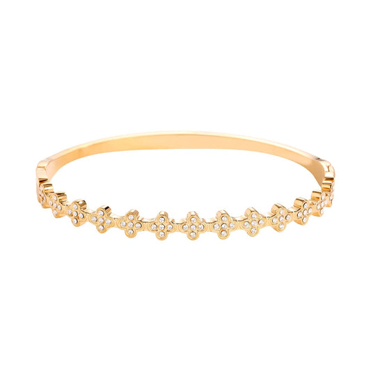 Eleganter Armreif mit funkelnden Kleeblatt-Motiven